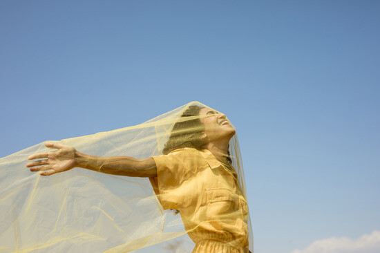 portrait-joyful-woman-with-yellow-cloth-nature.jpg