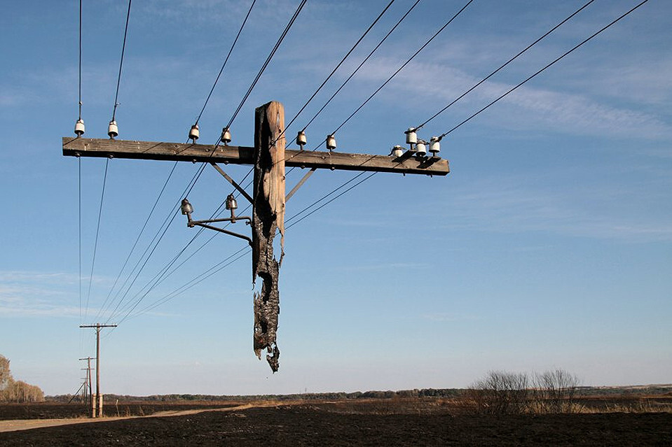 Electric pole hanging after a wild fire.jpg