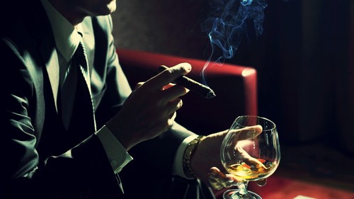 man-smoking-cigar-and-drinking-cognac-1280-720-823