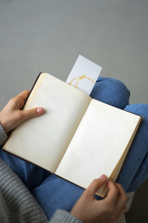 top-view-hands-holding-notebook_Easy-Resize.com (1