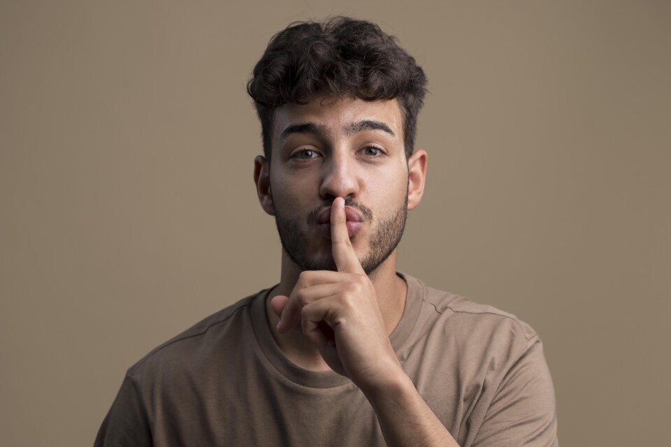 portrait-man-saying-shush.jpg