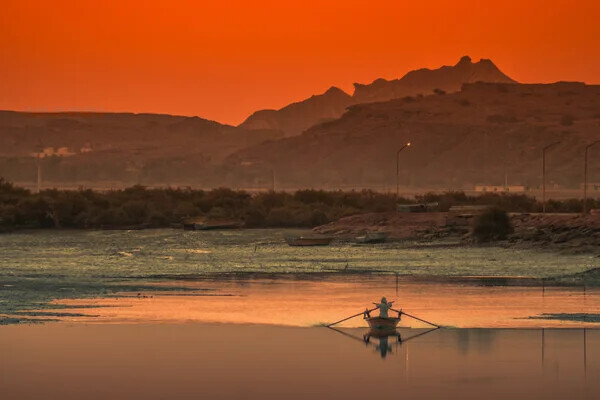 depositphotos_125291940-stock-photo-man-in-a-boat.