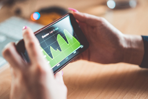 young-woman-analyzing-website-traffic-earnings-cha