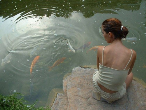 Girl and Koi Fish - Sandra V