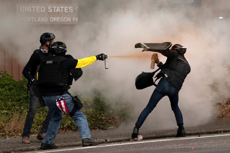 Members of the far-right Proud Boys clash with cou