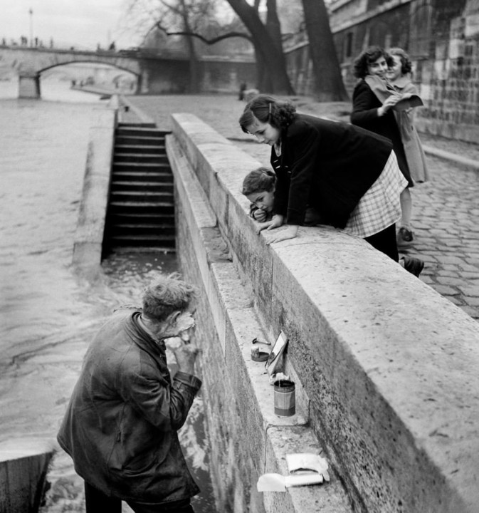 A man shaving at the dock along the Seine, Paris 1