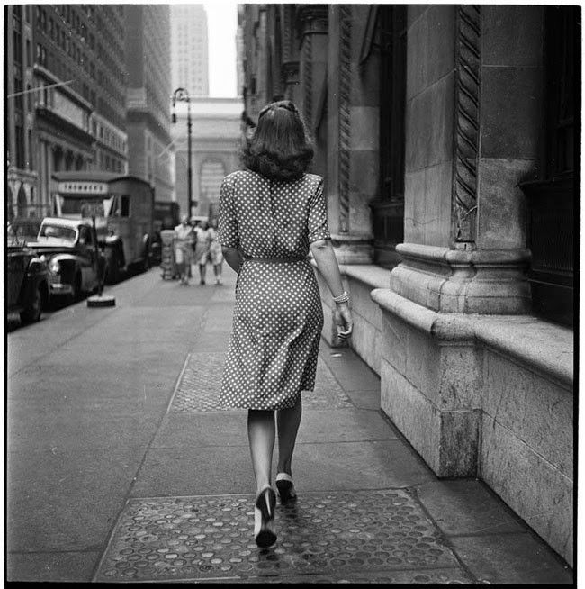 A woman confidently strides down a New York street