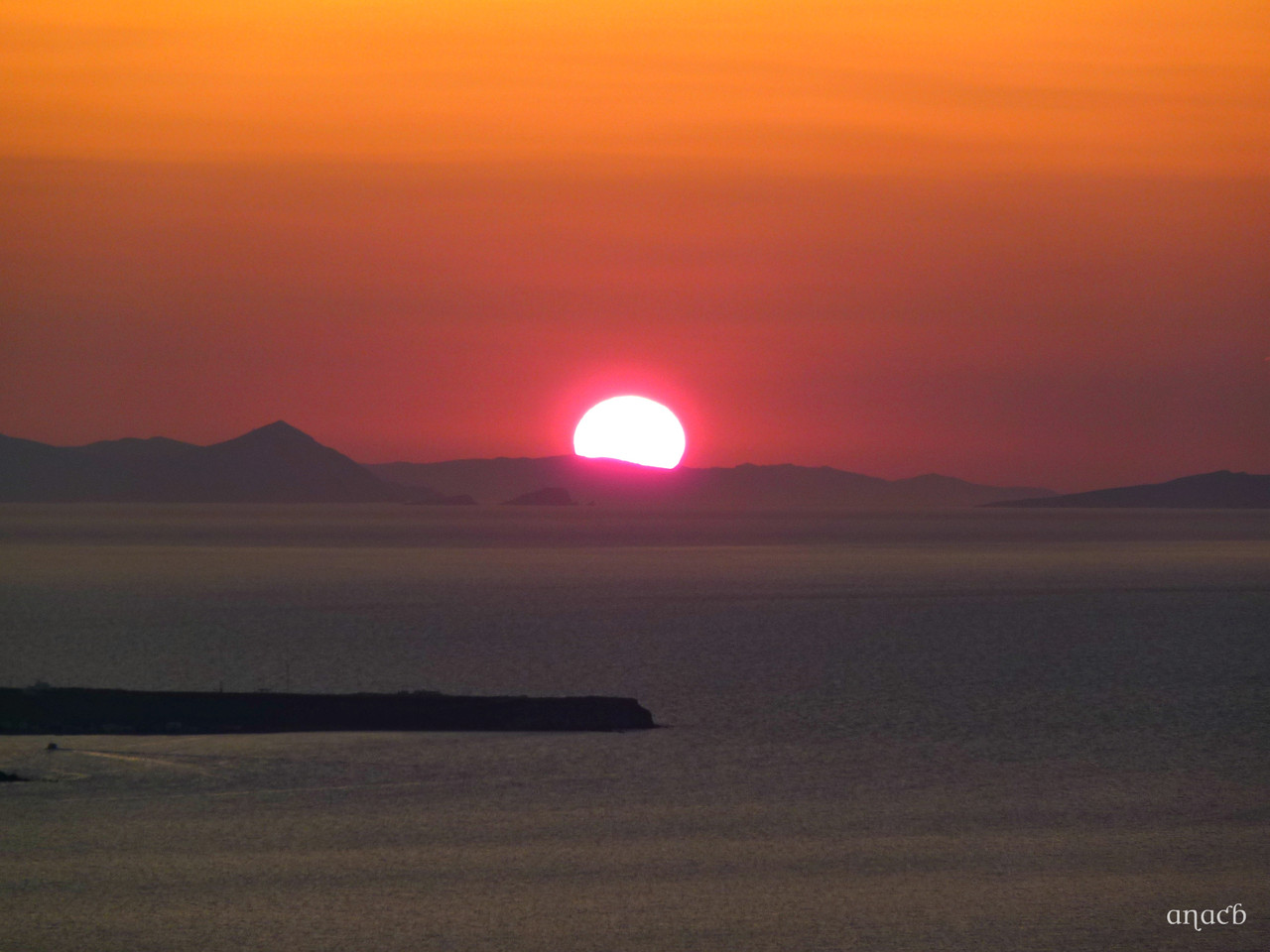 Santorini-o pôr-do-sol visto de Fira (1553) cópi