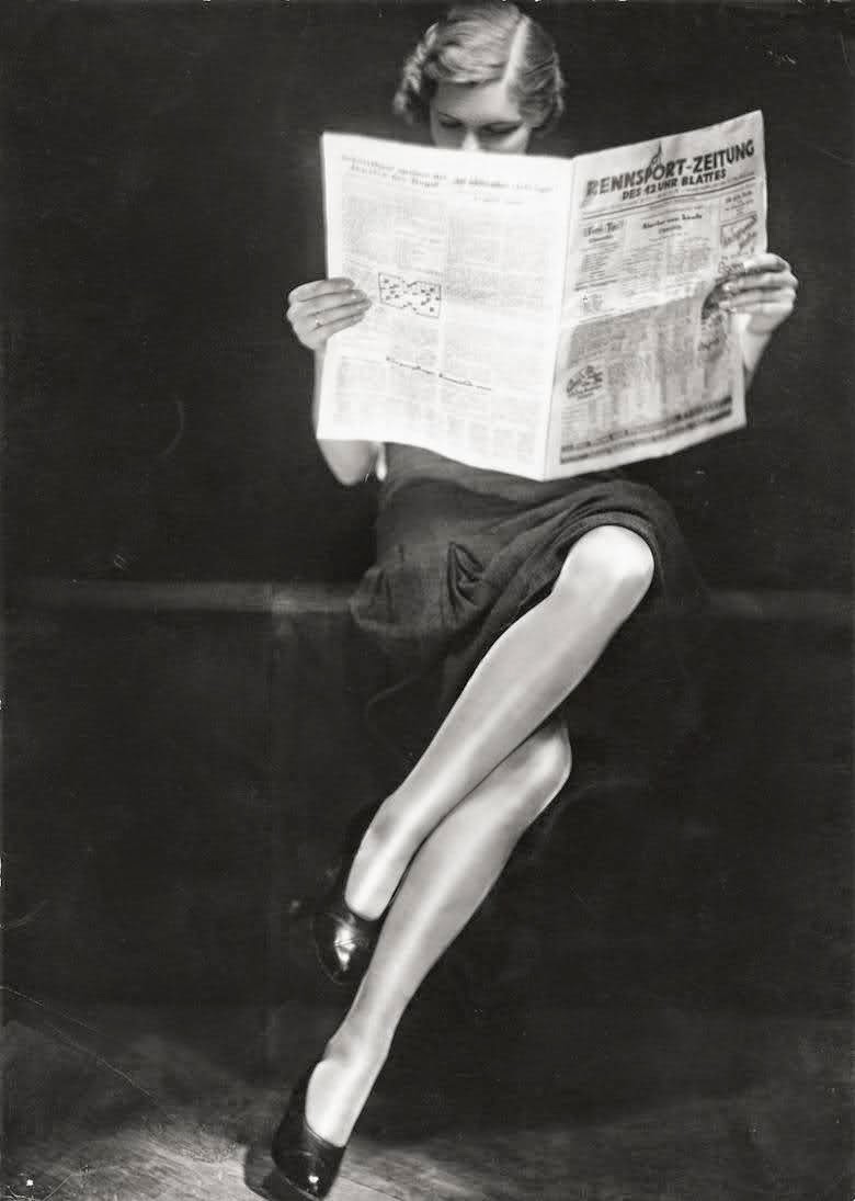 A lady reading newspaper, 1932.jpg